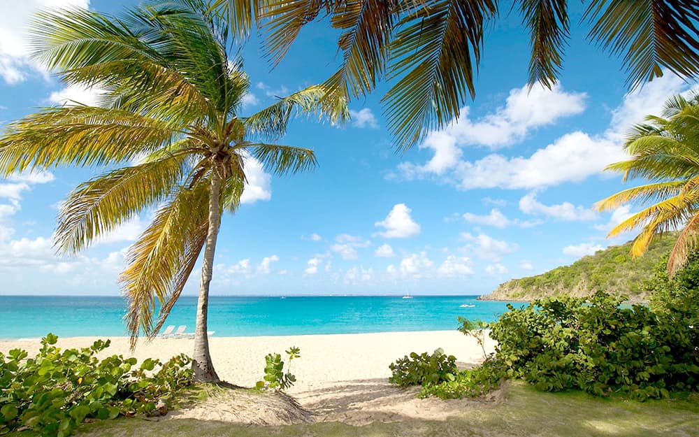 A widescreen photograph of St Maarten from the island.