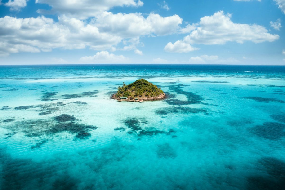 Tropical island surrounded by turquoise Caribbean waters