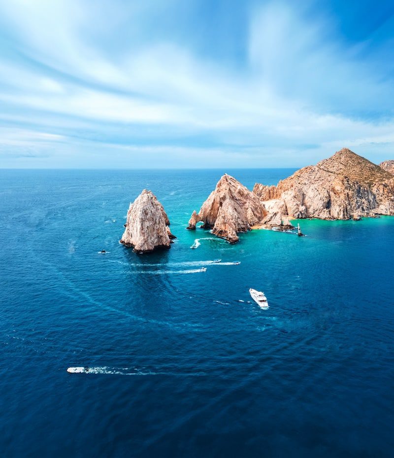 Sea scape on the Mexican coast with yacht activity.